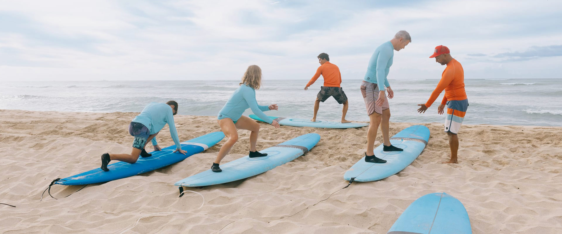 Learn the basics on sand and then surf and catch some waves